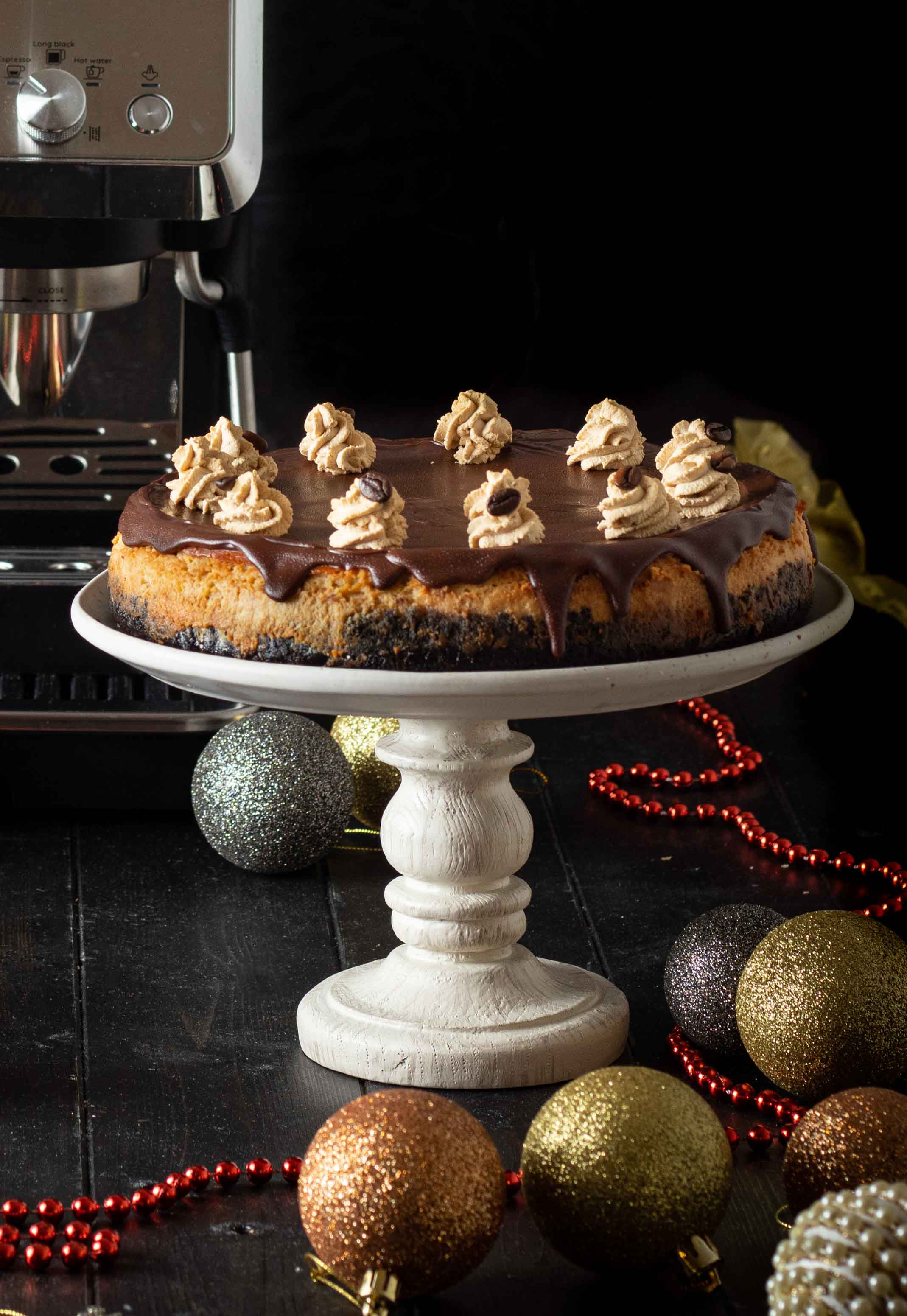 Baked coffee cheesecake with dark chocolate ganache and mocha cream frosting