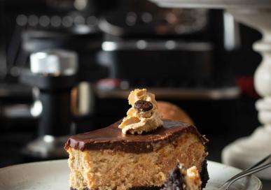 Baked coffee cheesecake with dark chocolate ganache and mocha cream frosting